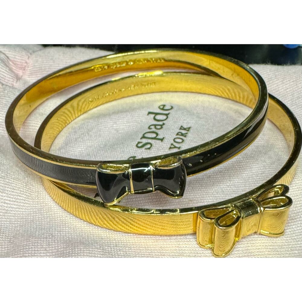 Kate Spade Pair of Take A Bow Bangles, Black And Gold with Dustbag